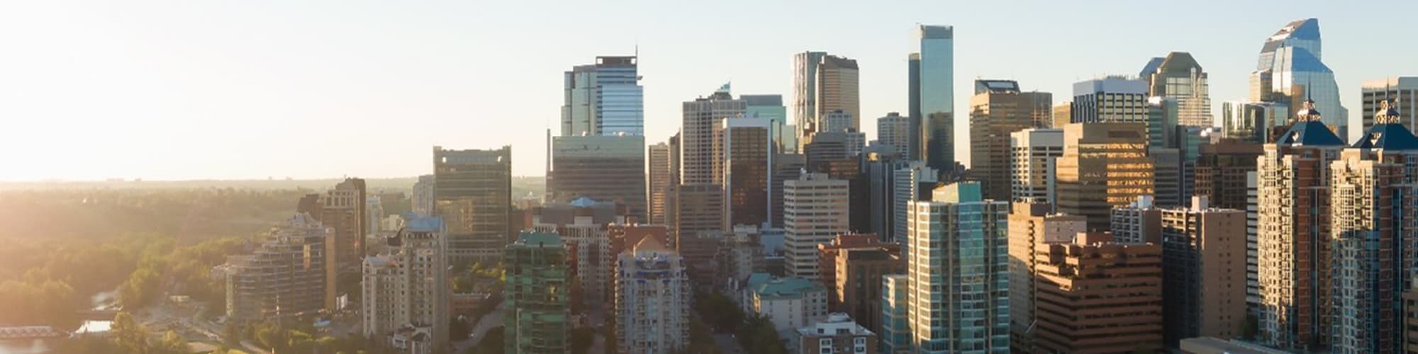 City skyline with modern skyscrapers at sunset, symbolizing sustainable urban development, urbanization, and ESG transformation in business