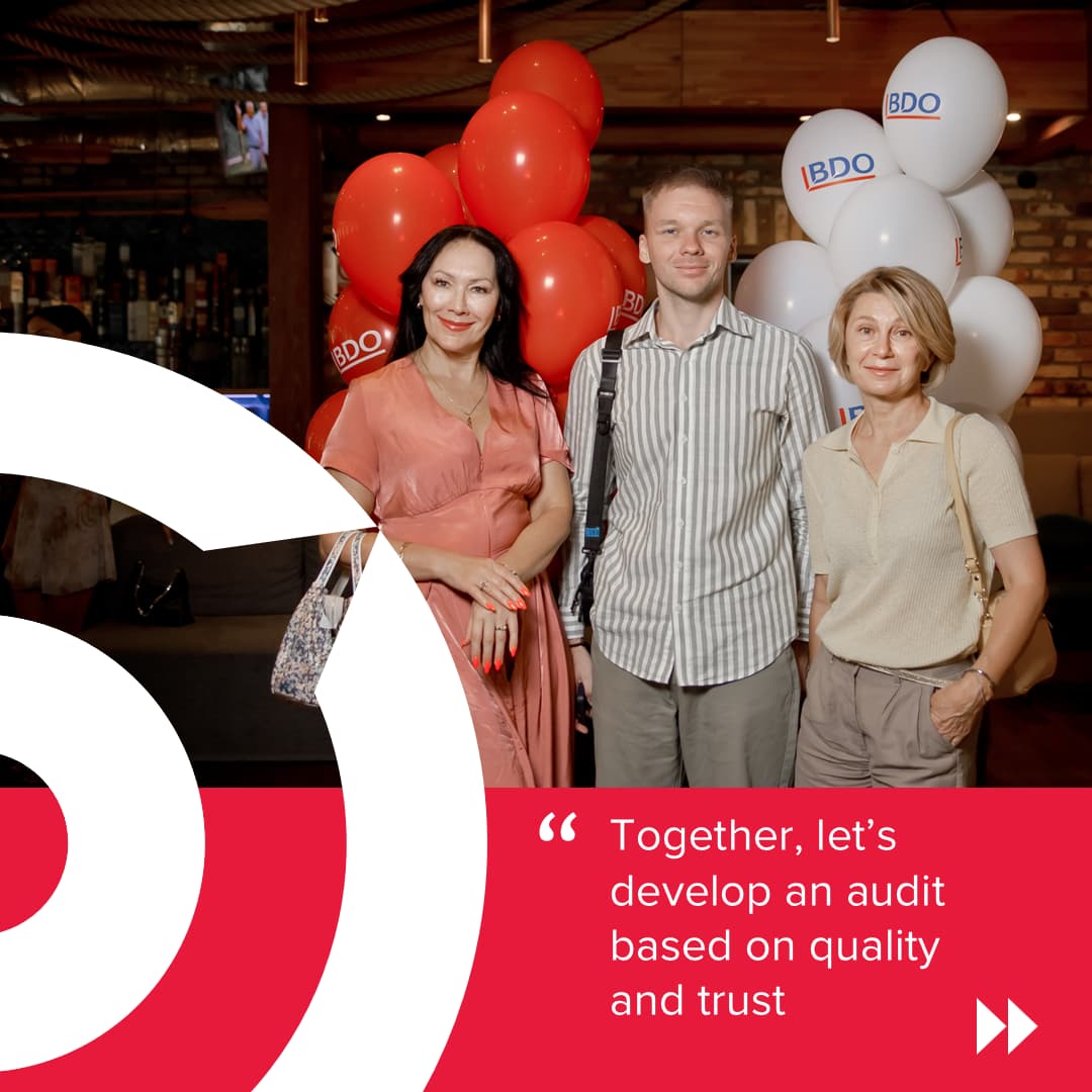 BDO in Ukraine team members at Auditor Proud Day 2026 networking event, standing near branded red and white balloons, highlighting audit excellence, professional development, quality assurance, and trust in the audit profession